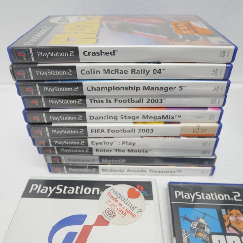 8033 - A limited edition silver PlayStation 2 with 14 boxed PlayStation 2 games
