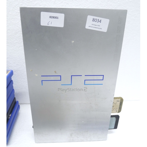 8034 - A limited edition silver PlayStation 2 with 14 boxed PlayStation 2 games