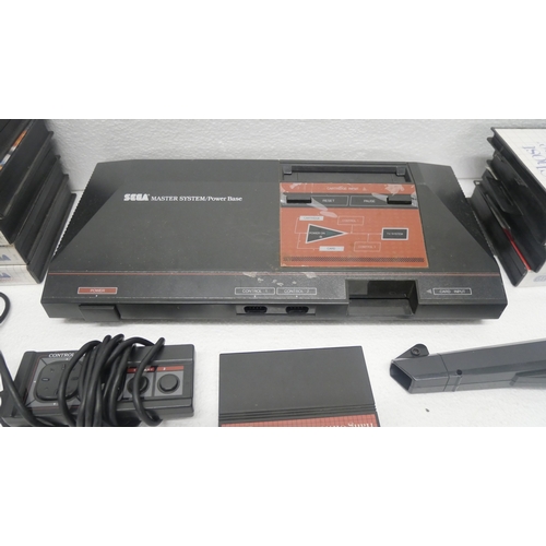 8041 - A Sega Master System/Power Base games console with power supply, control pad, aerial cable, light ph... 