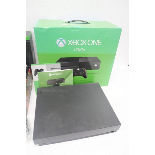 8050 - A large quantity of Xbox items including, a Project Scorpio Xbox One X in an Xbox One box with third... 
