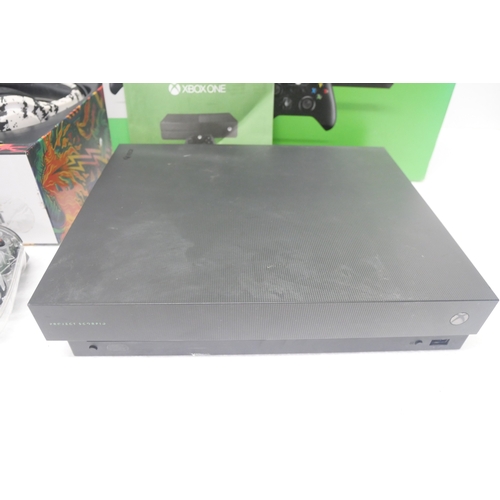 8050 - A large quantity of Xbox items including, a Project Scorpio Xbox One X in an Xbox One box with third... 