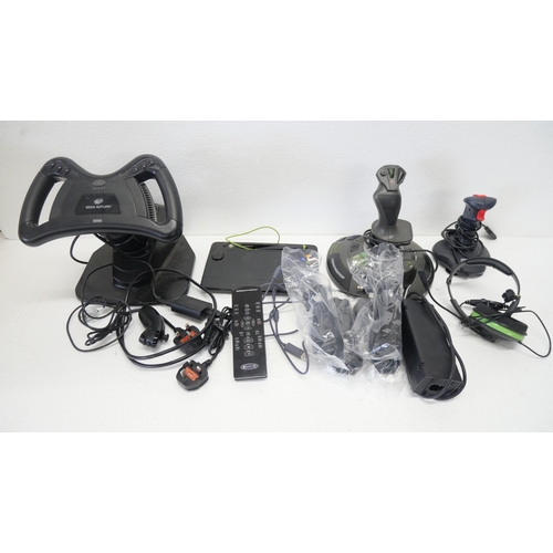 8053 - A quantity of gaming peripherals including, a Sega Saturn MK-80304 racing wheel, an Xbox Thrustmaste... 