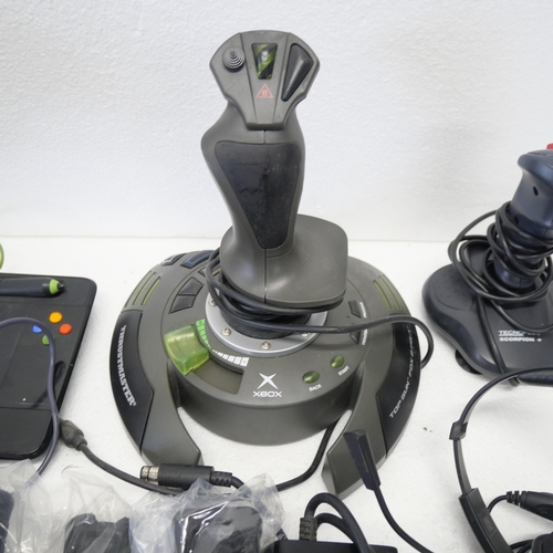 8053 - A quantity of gaming peripherals including, a Sega Saturn MK-80304 racing wheel, an Xbox Thrustmaste... 