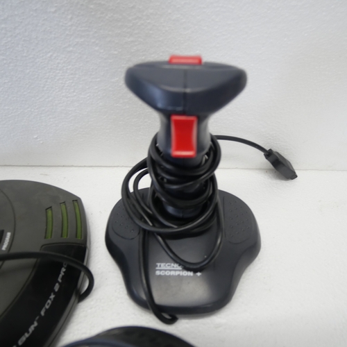 8053 - A quantity of gaming peripherals including, a Sega Saturn MK-80304 racing wheel, an Xbox Thrustmaste... 