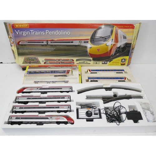 Two Hornby model train sets - a Networker Suburban train and a Virgin ...
