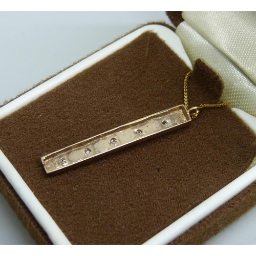 7001 - A 9ct gold ingot pendant set with diamonds, on a 9ct gold necklace chain, 2.2g total, pendant 3cm