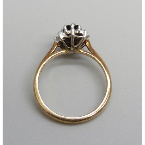 7003 - A 9ct gold, sapphire and diamond ring, 2.8g, N