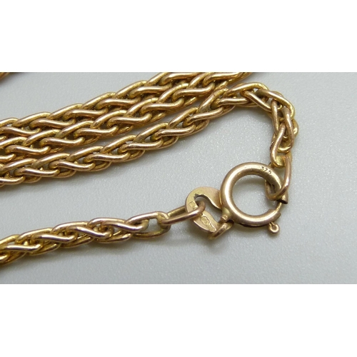 7004 - A 9ct gold chain with a yellow metal locket pendant, 3.4g total, 40.5cm