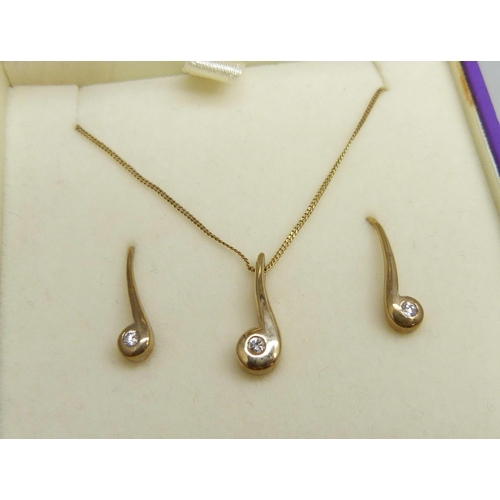 7005 - A yellow metal and white stone matching pendant and earrings set, chain marked 375, 2.5g total weigh... 