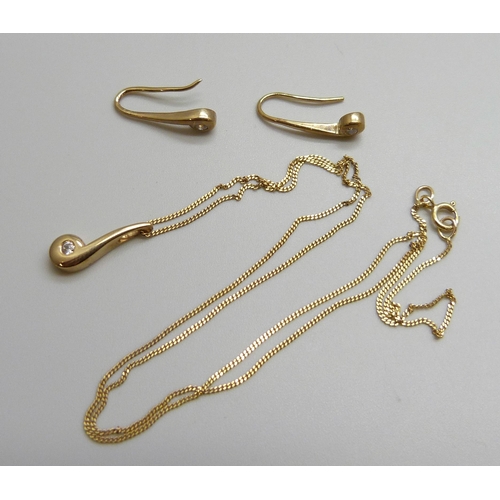 7005 - A yellow metal and white stone matching pendant and earrings set, chain marked 375, 2.5g total weigh... 