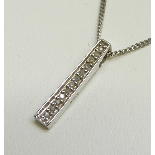 7006 - A 9ct white gold and diamond bar pendant on a 9ct white gold chain, 3.7g, 2cm pendant