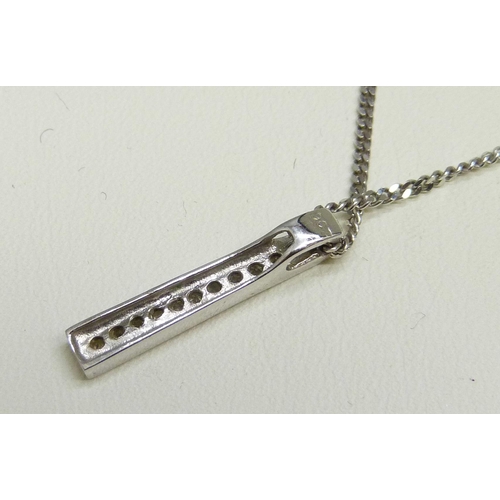 7006 - A 9ct white gold and diamond bar pendant on a 9ct white gold chain, 3.7g, 2cm pendant
