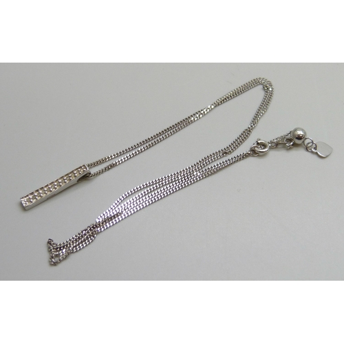 7006 - A 9ct white gold and diamond bar pendant on a 9ct white gold chain, 3.7g, 2cm pendant