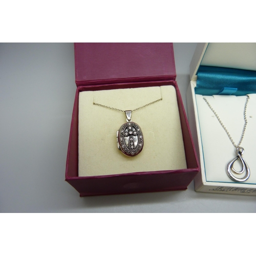 7015 - A silver Kit Heath pendant on a silver chain, and a silver locket with cross detail on a silver chai... 