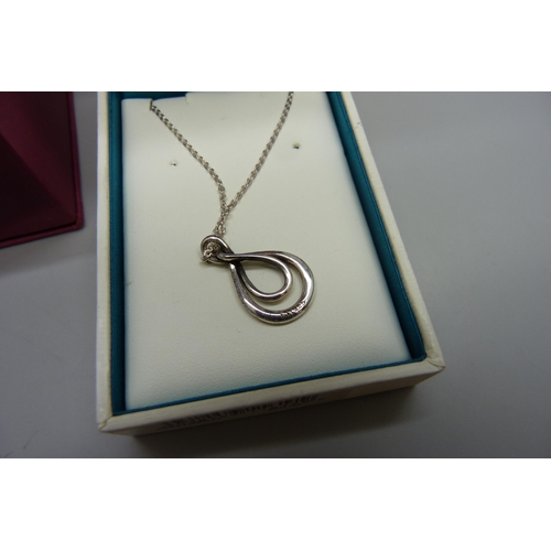 7015 - A silver Kit Heath pendant on a silver chain, and a silver locket with cross detail on a silver chai... 