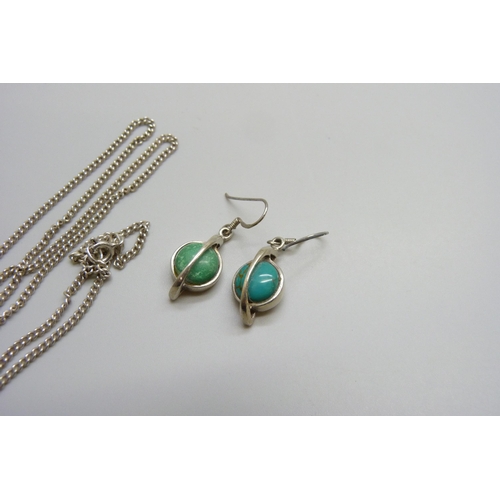 7018 - A white metal floral pendant, and a pair of turquoise set silver earrings, pendant 4cm including bal... 