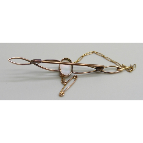 7024 - A yellow metal bar brooch set with an opal, 1.9g, 5.3cm
