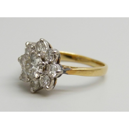 7025 - An 18ct gold diamond cluster ring, 2.1g, F/G