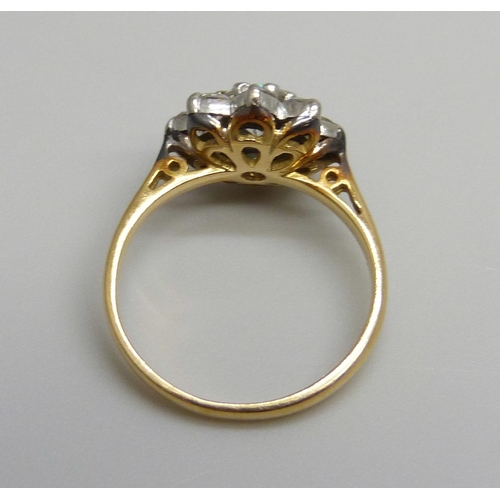 7025 - An 18ct gold diamond cluster ring, 2.1g, F/G