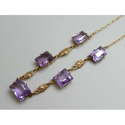 7028 - A 9ct gold five stone amethyst drop necklace, 5.5g, 36.5cm