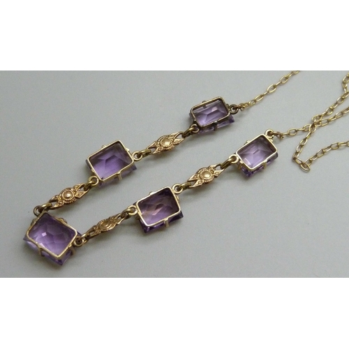 7028 - A 9ct gold five stone amethyst drop necklace, 5.5g, 36.5cm