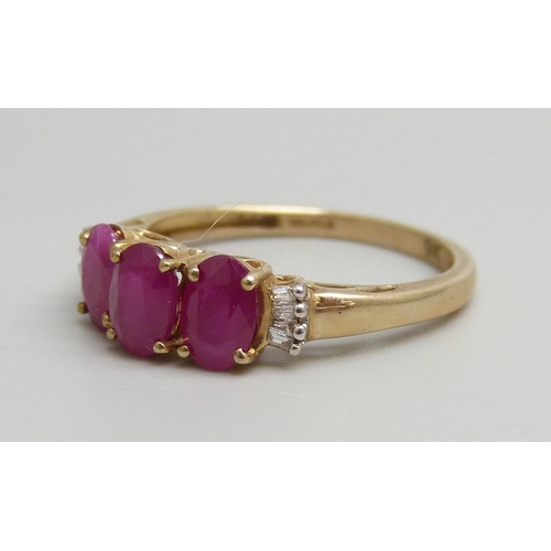 7040 - A 9ct gold, Burmese ruby and diamond ring, 1.8g, O