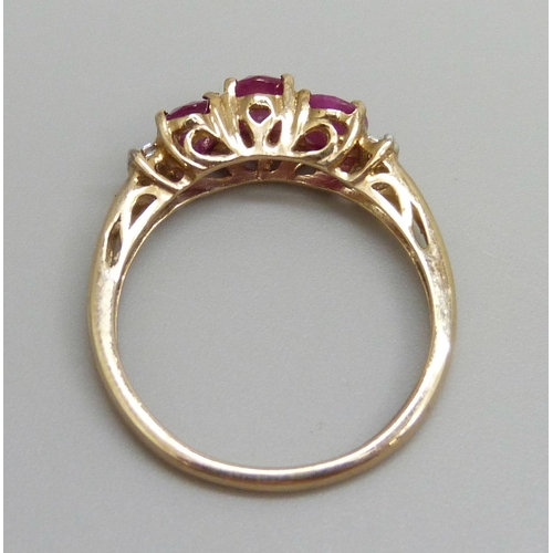 7040 - A 9ct gold, Burmese ruby and diamond ring, 1.8g, O