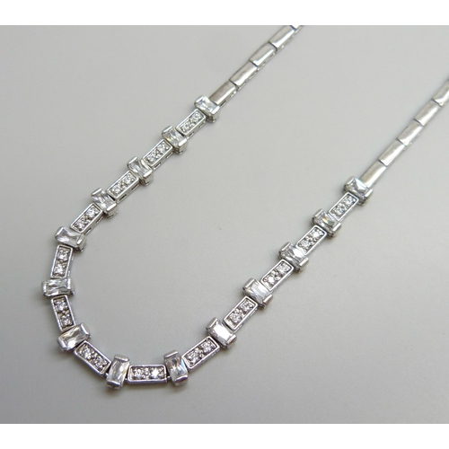7044 - A hallmarked silver tennis necklace set with white stones, 21g, 40.5cm