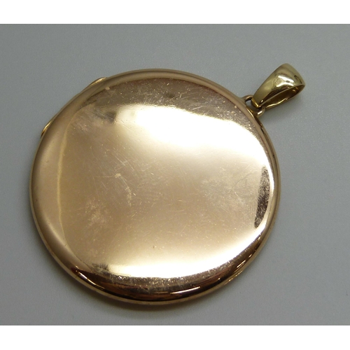 7050A - A 15ct gold locket, 17.4g, 5cm including bale