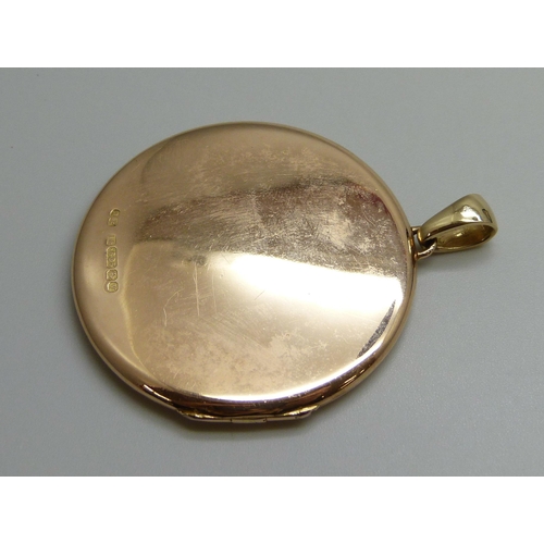 7050A - A 15ct gold locket, 17.4g, 5cm including bale