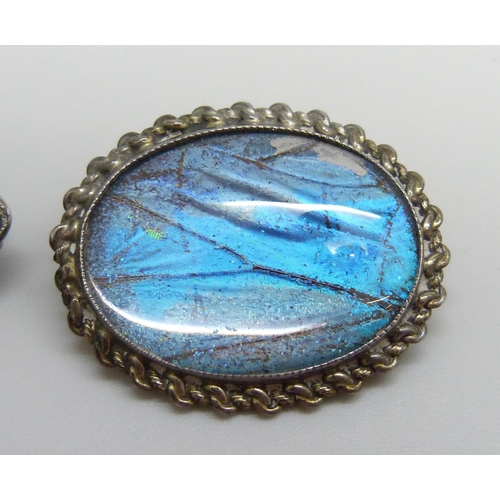 7052 - Two early 20th Century brooches, a white metal example set with a green stone and marcasite, 4.2cm, ... 