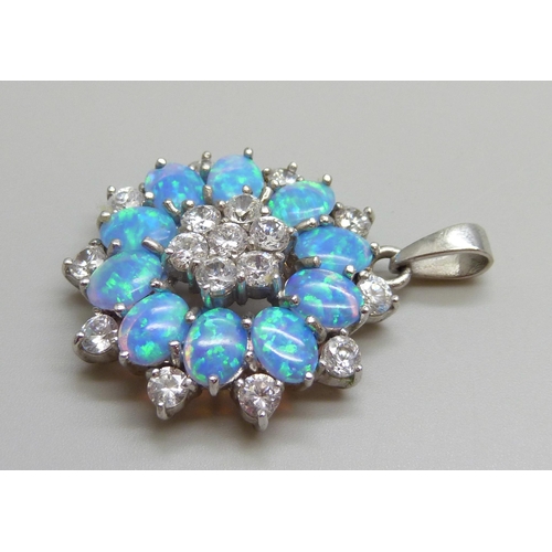 7054 - A large silver pendant set with cubic zirconia stones and synthetic opals, 14.6g, 4.2cm including ba... 