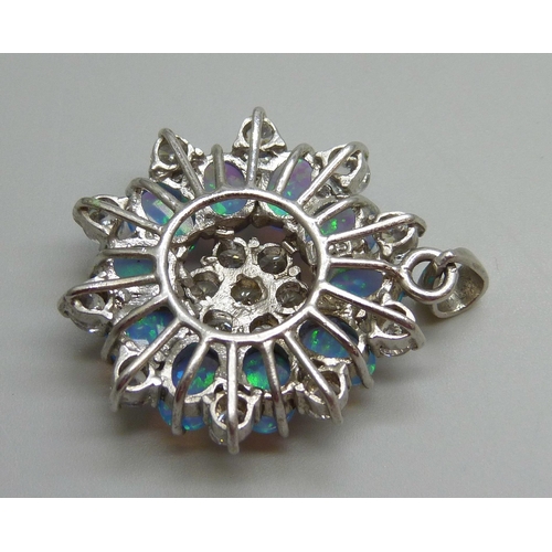 7054 - A large silver pendant set with cubic zirconia stones and synthetic opals, 14.6g, 4.2cm including ba... 