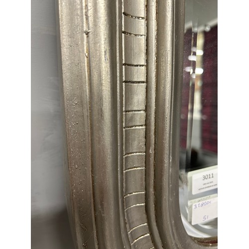 3005 - A silver effect carved framed mirror