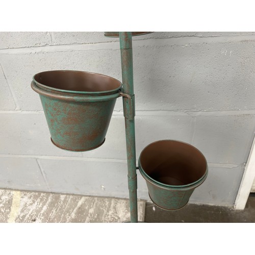 3017B - A rustic green umbrella plant pot stand