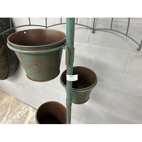 3017B - A rustic green umbrella plant pot stand