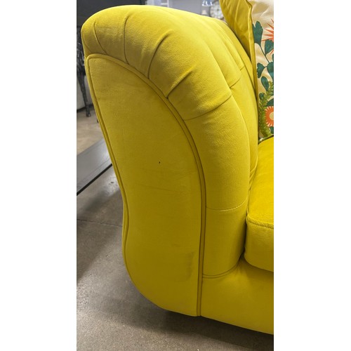 3017 - A lemon velvet upholstered 2 seater sofa
