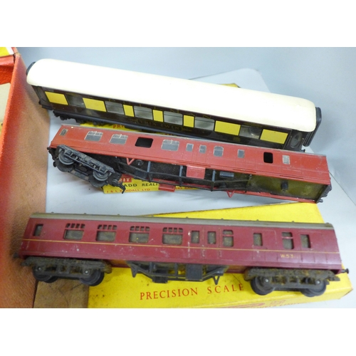 A collection of Tri-ang model railway, carriages, wagons and track, in ...