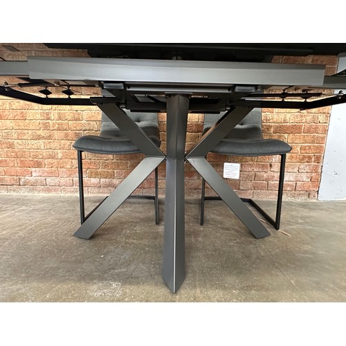 3115 - A Naples twist top printed glass extending dining table and four Hampton pewter upholstered dining c... 