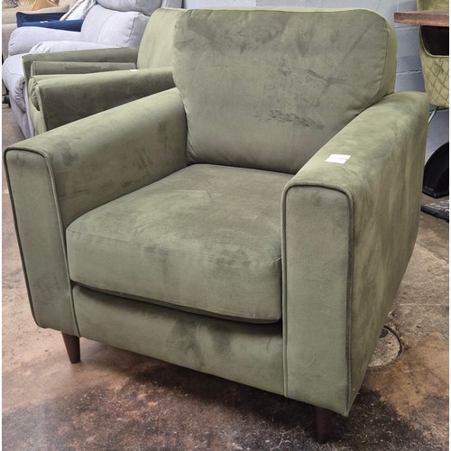 3117 - A moss green velvet upholstered armchair and matching pouffe