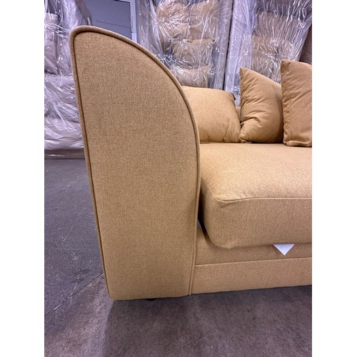 3128 - A mustard fabric upholstered three seater sofa, bagged