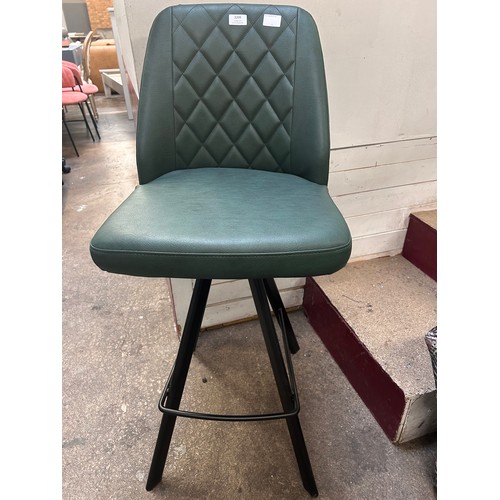 3132 - A racing green leather upholsted and black metal bar stool