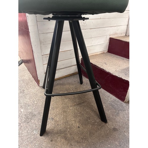 3132 - A racing green leather upholsted and black metal bar stool