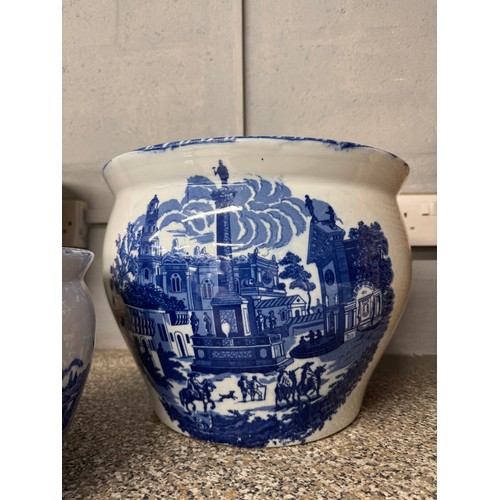 3145 - Two graduated white and blue ceramic planters