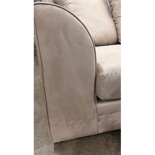 3152 - A champagne vegan suede upholstered three seater sofa