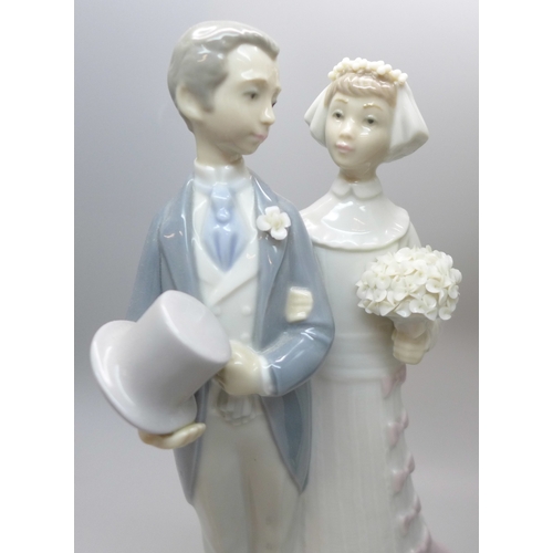 2011 - Two Lladro figures, wedding day bride and groom, 19.5cm, and 5123 My Precious Bundle