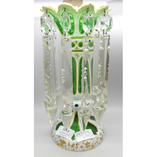 2012 - A 19th century Bohemian green and white glass lustre with gilt detail and clear glass droplets, 26cm... 