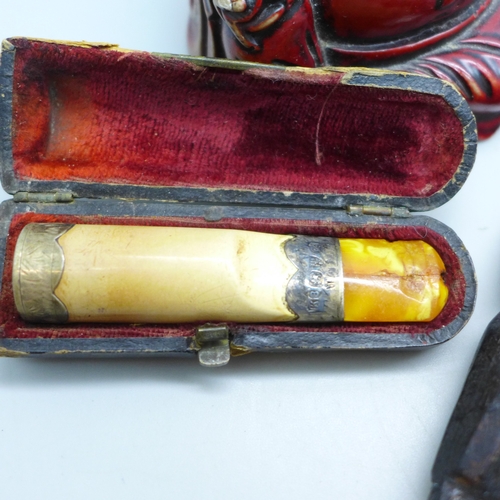 2017 - A late Victorian silver banded cheroot holder, a Buddha figure, a carved wooden item, a plated spoon... 