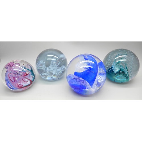 2022 - Four glass paperweights including two CIIG Caithness examples and other Caithness in blue with contr... 