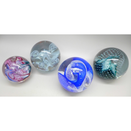 2022 - Four glass paperweights including two CIIG Caithness examples and other Caithness in blue with contr... 